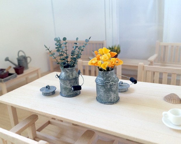Vintage cream cans hold flowers